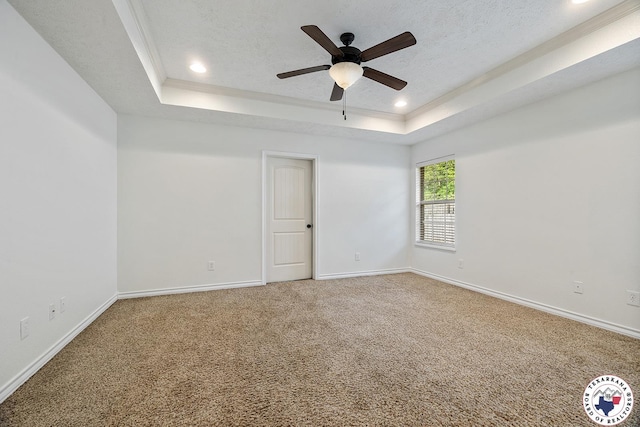 3604 Melody Ln, Texarkana, TX 75503 - carpeted spare room with a tray ceiling, baseboards, ceiling fan, recessed lighting, and a textured ceiling