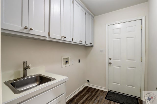 laundry area with dark hardwood / wood-style flooring, sink, hookup for an electric dryer, hookup for a washing machine, and cabinets