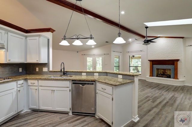 kitchen featuring sink, white cabinetry, pendant lighting, and appliances with stainless steel finishes