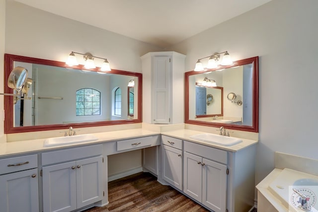 bathroom featuring hardwood / wood-style flooring and vanity