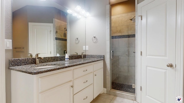 6908 Woodmere Ct, Texarkana, TX 75503 - bathroom featuring a shower stall, double vanity, and tile patterned flooring