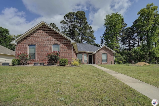 6908 Woodmere Ct, Texarkana, TX 75503 - view of front facade with brick siding and a front lawn