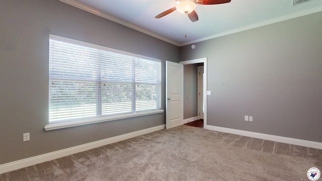 6908 Woodmere Ct, Texarkana, TX 75503 - empty room featuring ceiling fan, dark carpet, and ornamental molding