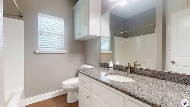 6908 Woodmere Ct, Texarkana, TX 75503 - full bathroom featuring vanity, wood finished floors, plenty of natural light, and shower / washtub combination