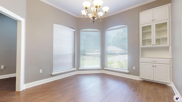 6908 Woodmere Ct, Texarkana, TX 75503 - unfurnished dining area featuring a chandelier, wood finished floors, plenty of natural light, and ornamental molding