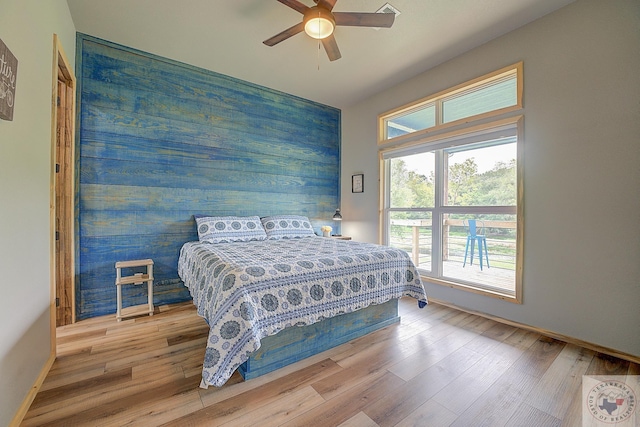 bedroom featuring ceiling fan and light wood-type flooring