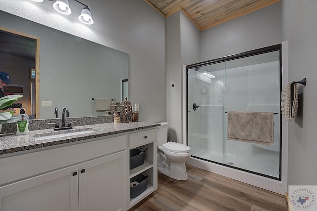 bathroom with walk in shower, wood-type flooring, vanity, and wood ceiling