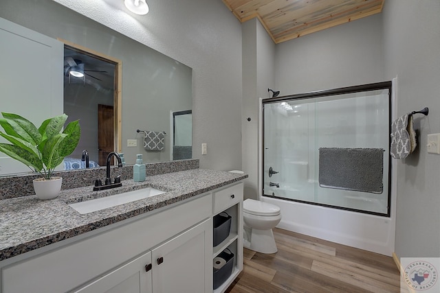 full bathroom with hardwood / wood-style floors, enclosed tub / shower combo, wood ceiling, vanity, and toilet