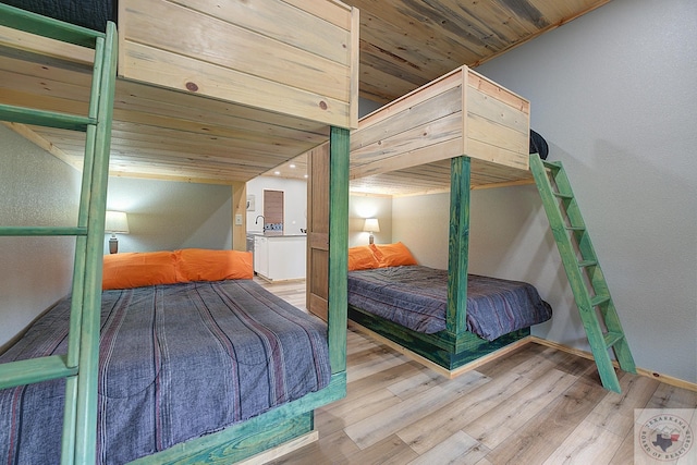 bedroom featuring wooden ceiling and hardwood / wood-style floors