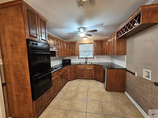 kitchen featuring black appliances, light tile patterned floors, decorative backsplash, sink, and ceiling fan