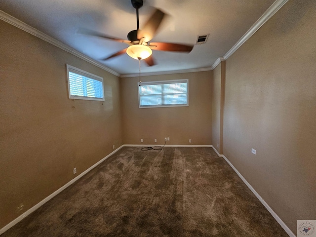 carpeted spare room with ceiling fan and ornamental molding