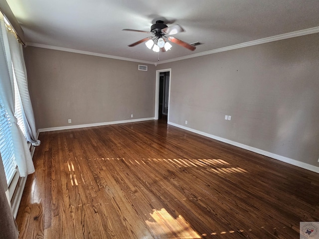 empty room featuring ceiling fan, dark hardwood / wood-style flooring, and crown molding