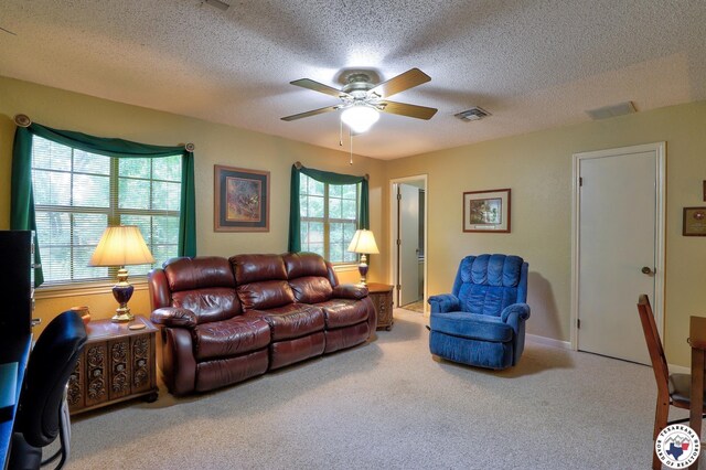 21 Holly Ridge Dr, Texarkana, TX 75503 - carpeted living room featuring a ceiling fan and a textured ceiling