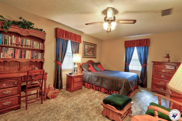 21 Holly Ridge Dr, Texarkana, TX 75503 - carpeted bedroom featuring a textured ceiling, a ceiling fan, and an office area