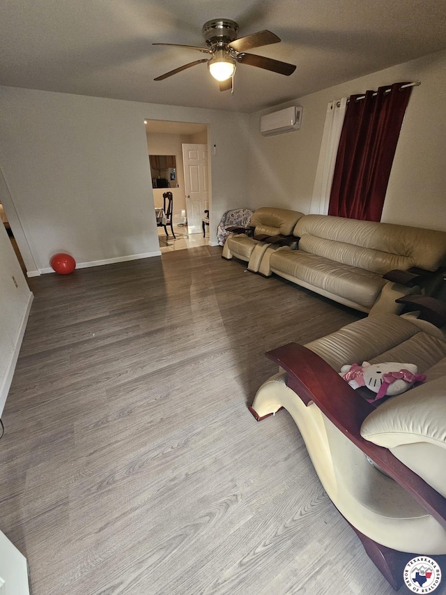 3514 Magnolia St, Texarkana, TX 75501 - living room with a ceiling fan, a wall mounted air conditioner, and wood finished floors