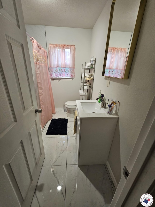 3514 Magnolia St, Texarkana, TX 75501 - full bath featuring marble finish floors, vanity, and a shower with shower curtain
