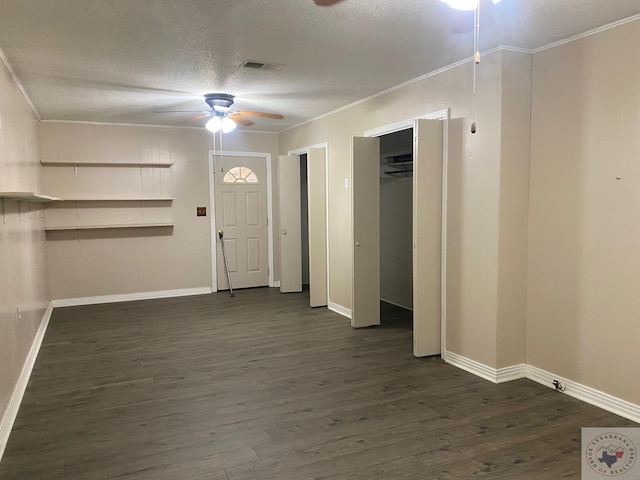 foyer featuring crown molding, a textured ceiling, ceiling fan, and dark hardwood / wood-style flooring