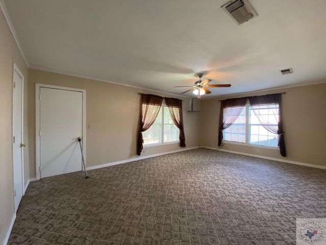 empty room featuring carpet flooring, ceiling fan, and ornamental molding