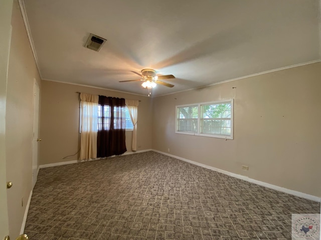 spare room featuring ceiling fan, ornamental molding, and carpet flooring