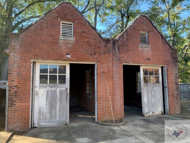 exterior space featuring an outbuilding and a garage