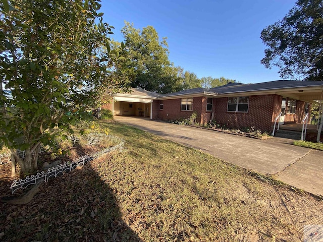 ranch-style house featuring a carport