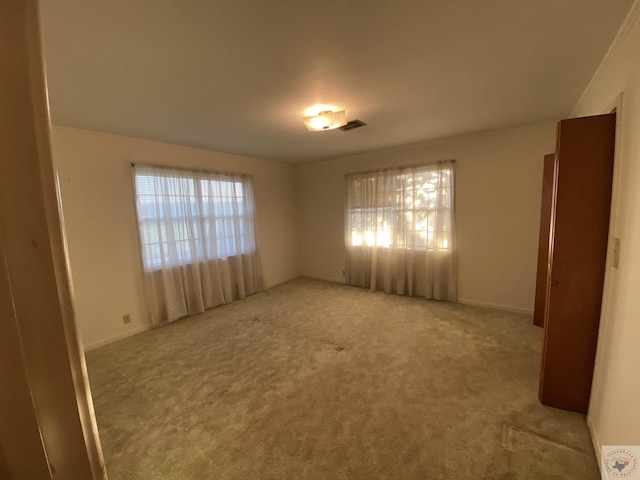 view of carpeted spare room