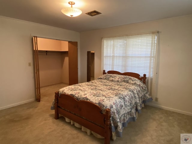 carpeted bedroom featuring a closet