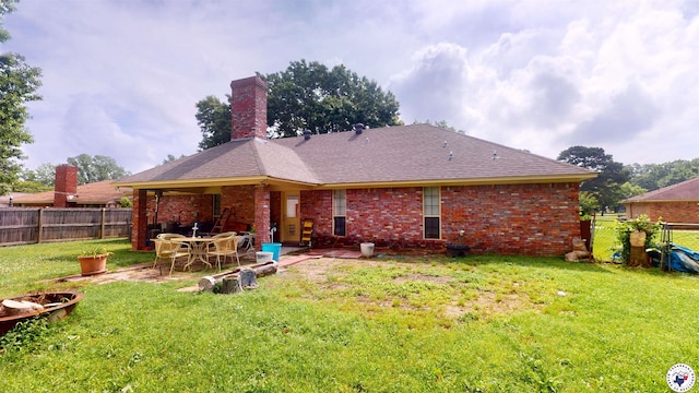 122 David Dr, New Boston, TX 75570 - back of house with brick siding, a chimney, and a patio area