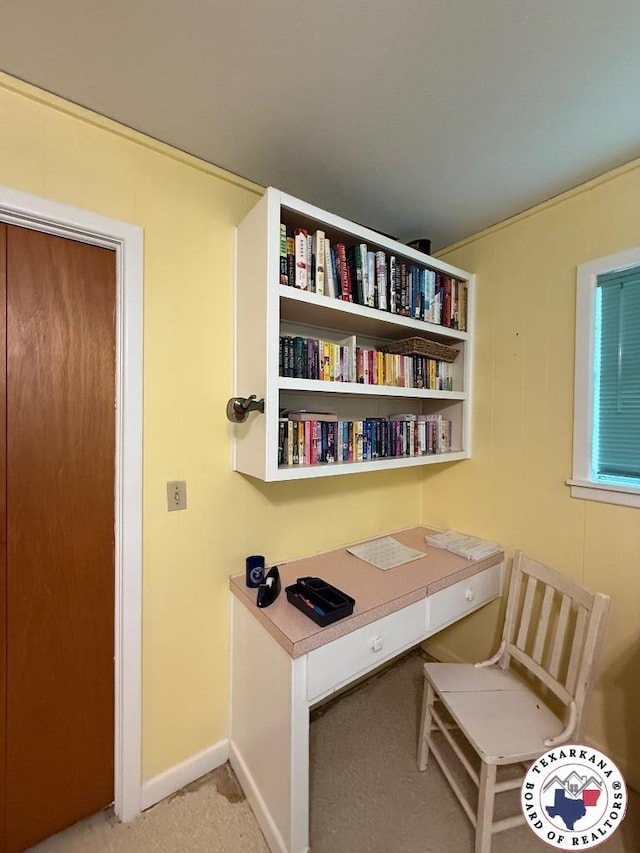 184 E Elliott Ln, Dekalb, TX 75559 - office featuring light carpet, baseboards, and built in study area
