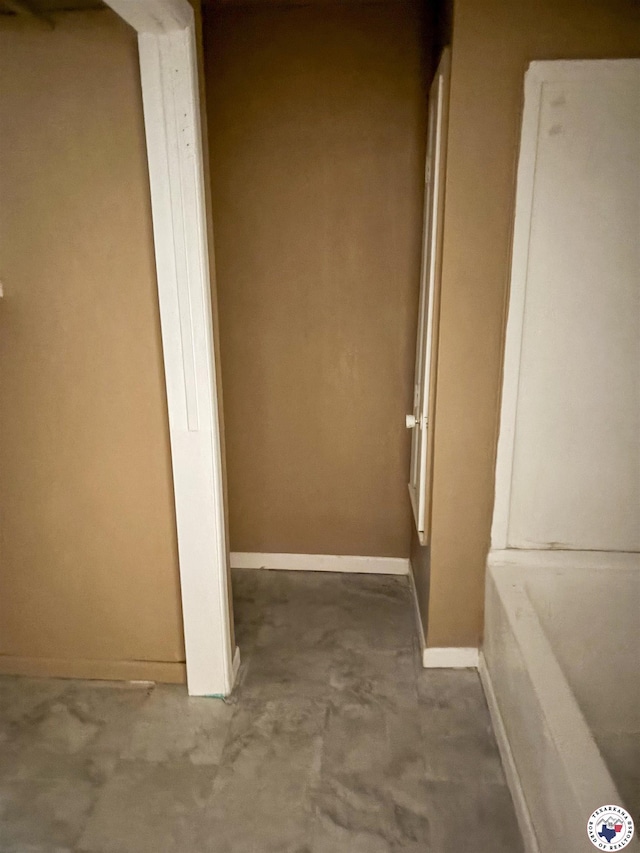 100 Roosevelt St, Hooks, TX 75561 - corridor featuring unfinished concrete flooring and baseboards