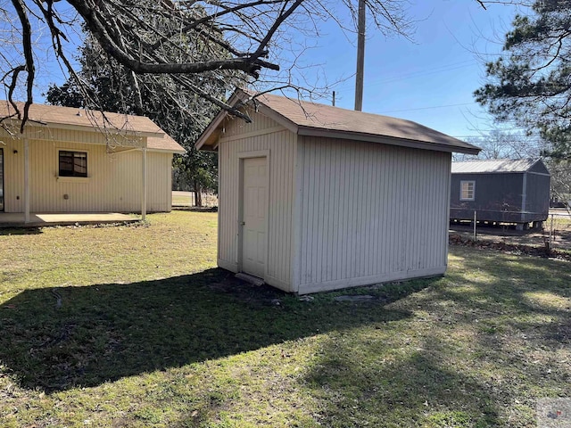 view of outdoor structure with a lawn