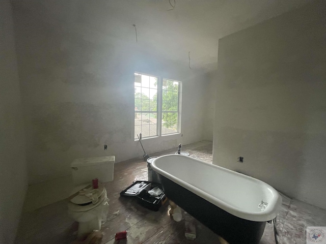 bathroom with a tub to relax in