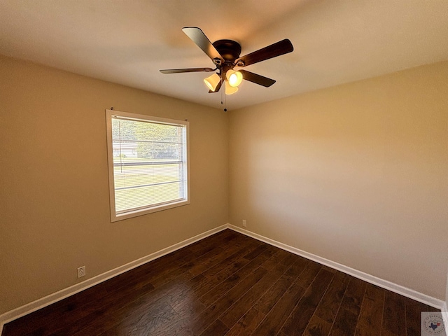 unfurnished room with dark wood-type flooring and ceiling fan