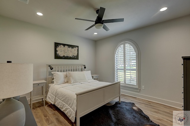 bedroom with light wood-type flooring and ceiling fan