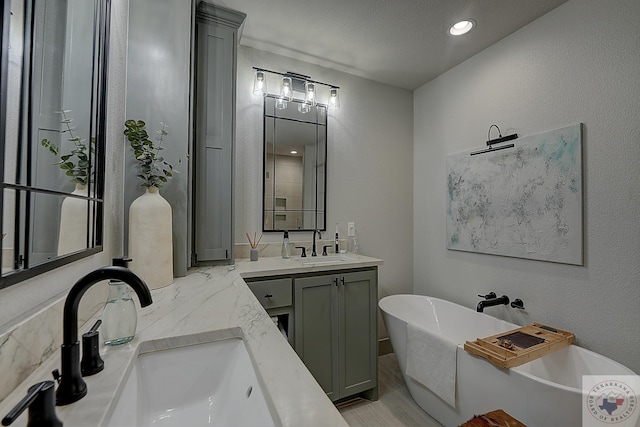 bathroom featuring a tub and vanity