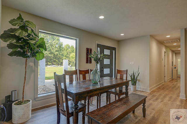 dining area with light hardwood / wood-style floors