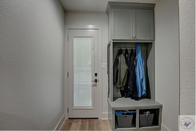 mudroom with light hardwood / wood-style flooring