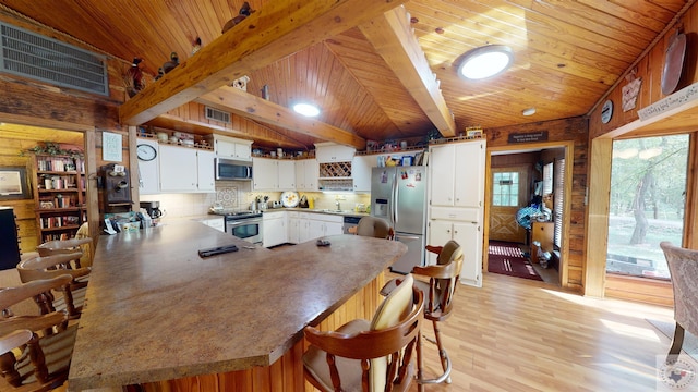 320 Riverside Dr, Horatio, AR 71842 - dining room featuring wooden ceiling, light hardwood / wood-style flooring, sink, and beamed ceiling