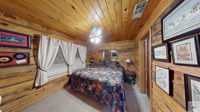 320 Riverside Dr, Horatio, AR 71842 - bedroom with wood walls, carpet flooring, and wooden ceiling