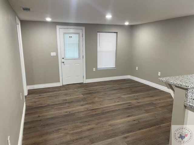 foyer with dark wood-type flooring