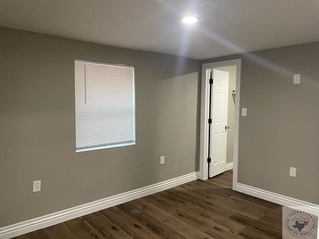 empty room featuring dark hardwood / wood-style floors