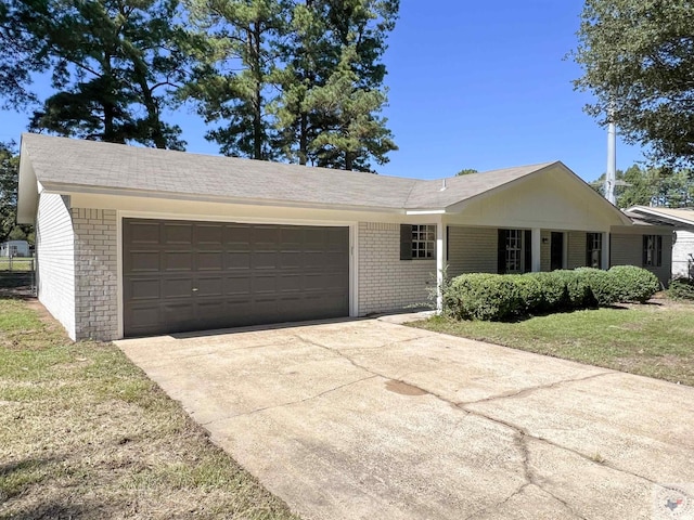 single story home with a garage and a front yard