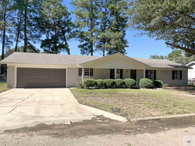 ranch-style home with a garage and a front lawn