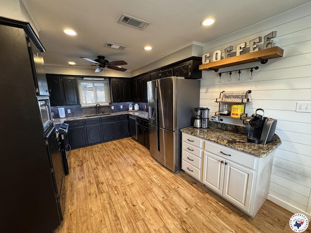 6515 N Kings Hwy, Texarkana, TX 75503 - kitchen with stainless steel refrigerator with ice dispenser, light wood-style flooring, open shelves, dark stone counters, and ceiling fan