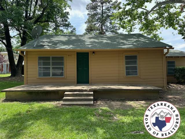 441 Johnson St, Nash, TX 75569 - rear view of house featuring a yard