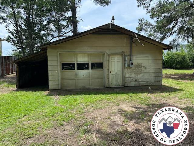 441 Johnson St, Nash, TX 75569 - view of outdoor structure featuring driveway