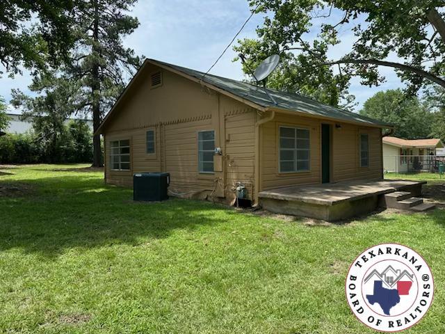 441 Johnson St, Nash, TX 75569 - back of property with a lawn