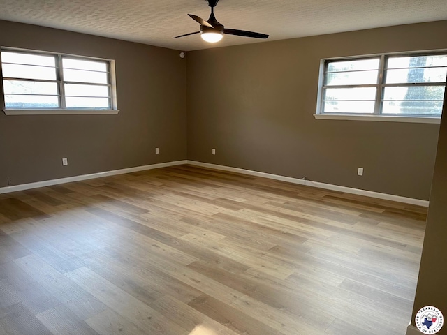 1 Sidney Dr, Texarkana, TX 75503 - unfurnished room with plenty of natural light, light wood-type flooring, and baseboards