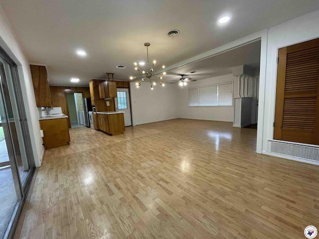 3123 Hickory St, Texarkana, AR 71854 - unfurnished living room with a chandelier, light wood-style floors, recessed lighting, and a ceiling fan