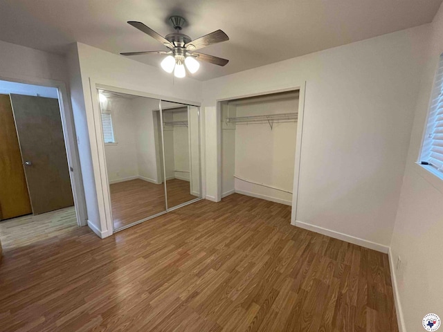 3123 Hickory St, Texarkana, AR 71854 - unfurnished bedroom with multiple closets, wood finished floors, and ceiling fan
